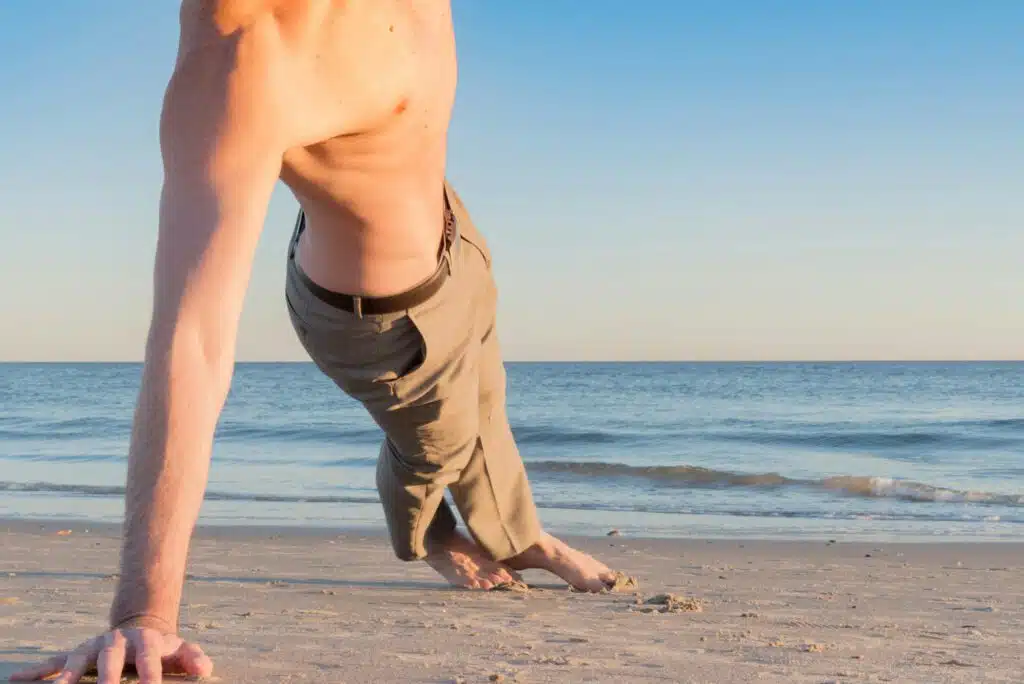 Side plank workout on beach.